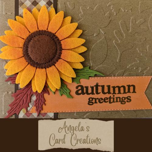 Handmade autumn card with felt sunflower, plaid accents, and "autumn greetings" text.