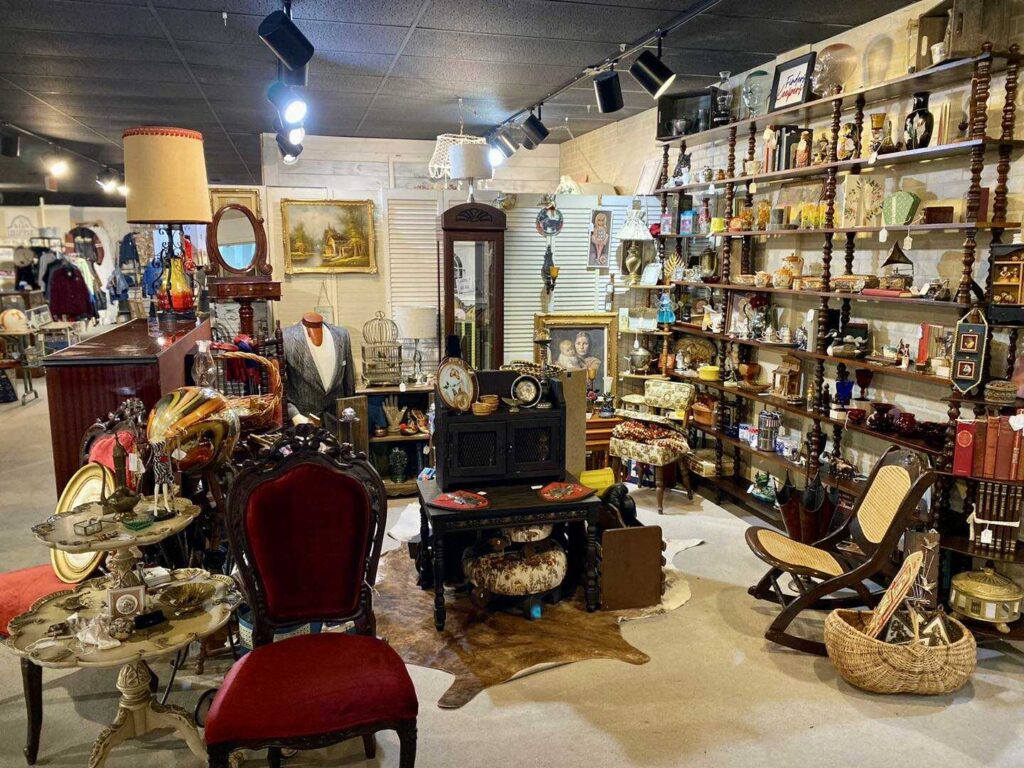 The image showcases a curated collection of vintage furniture and decor at Rabbit Creek Market.