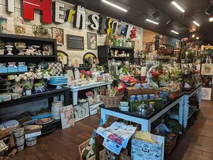 A vibrant display of vintage decor, florals, and eclectic treasures offering a nostalgic charm at Rabbit Creek Market.